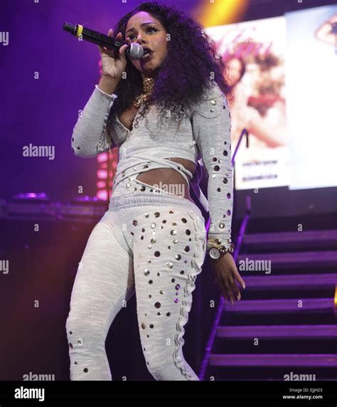 Lil’ Kim Performs in Red Thigh